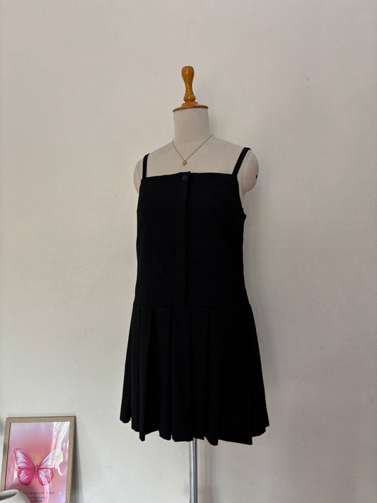 Black short straight cut dress with pleated bottom skirt.
