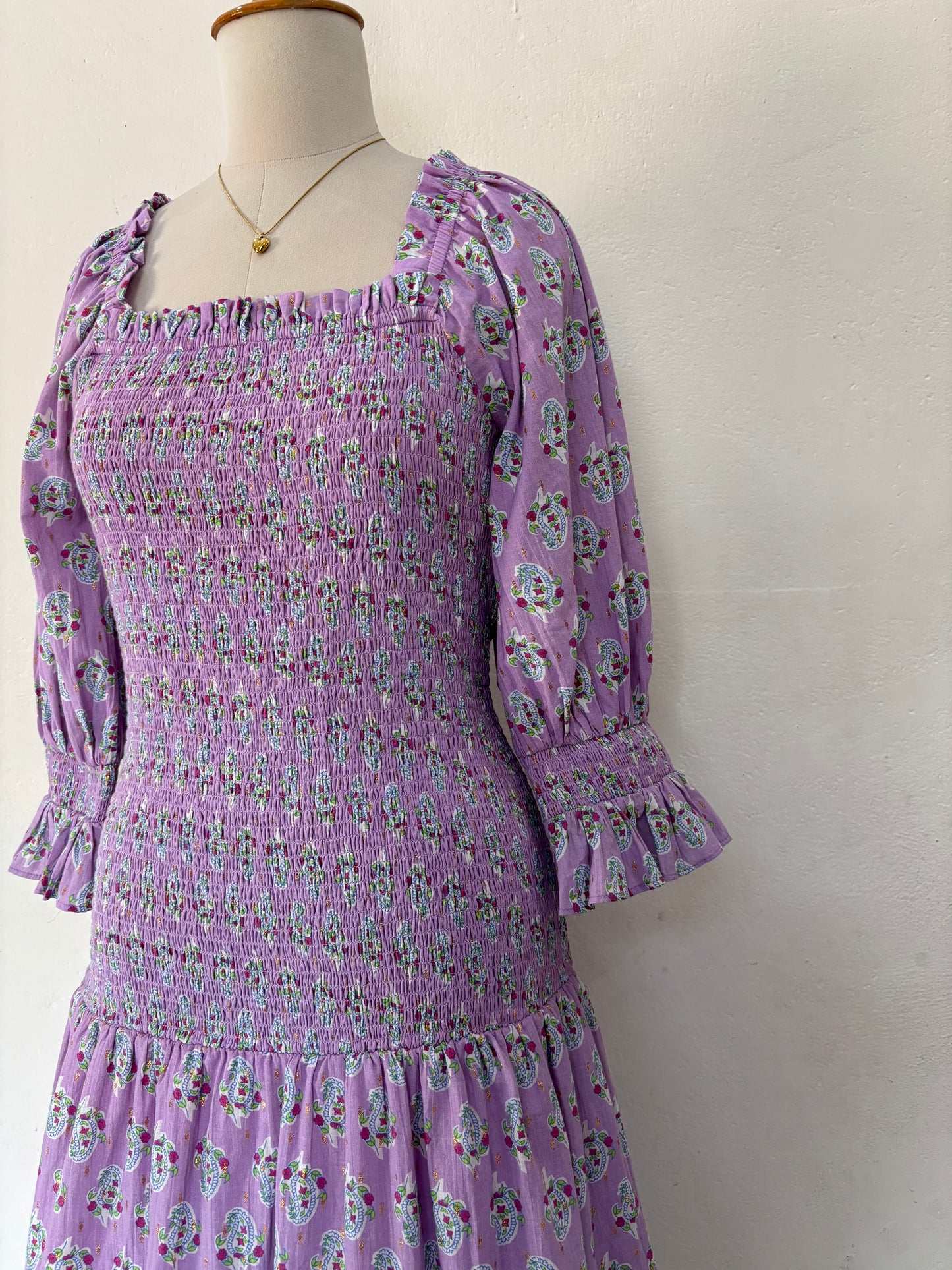 Purple smocked drop waist paisley print maxi dress.