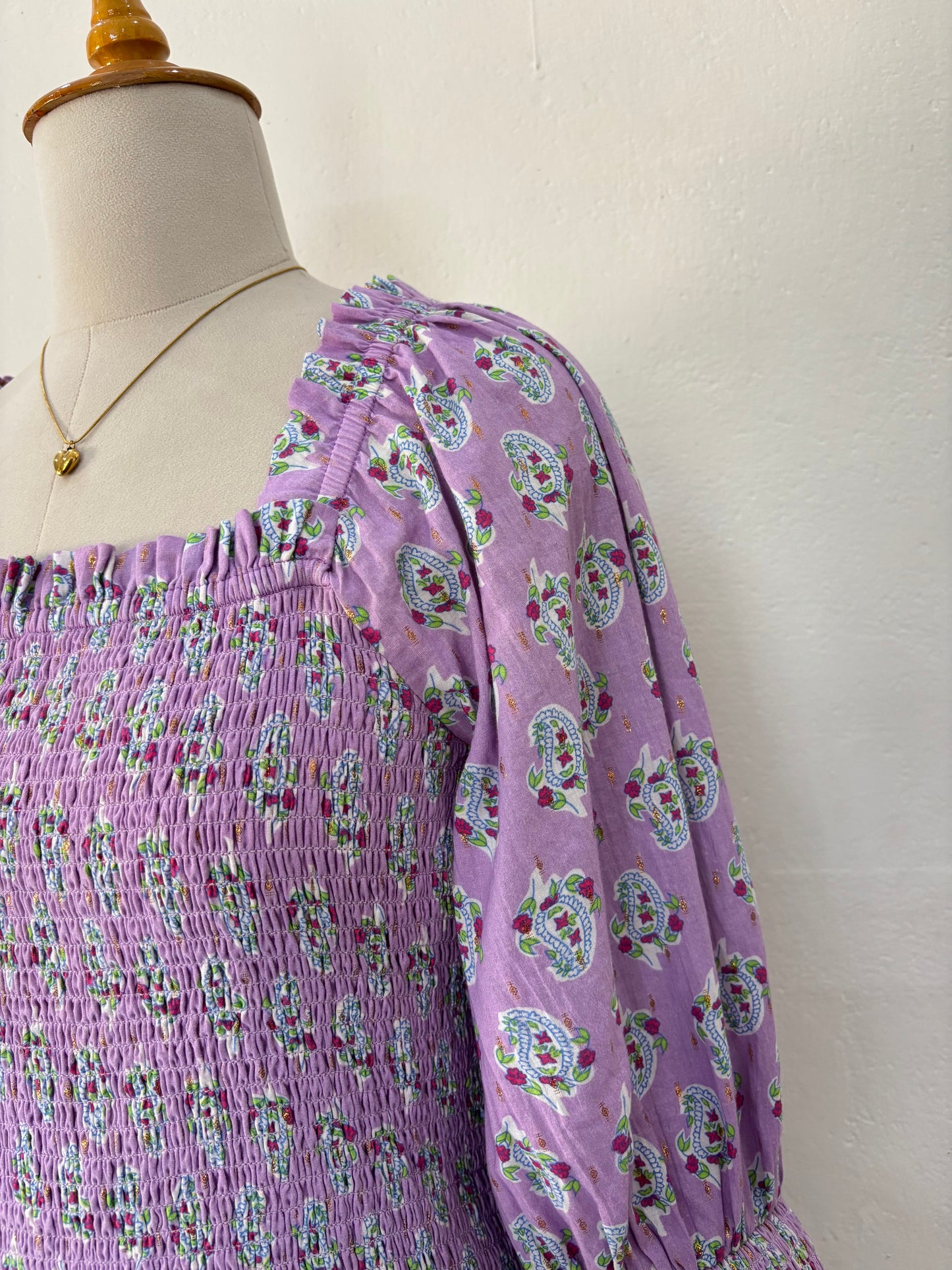 Purple smocked drop waist paisley print maxi dress.