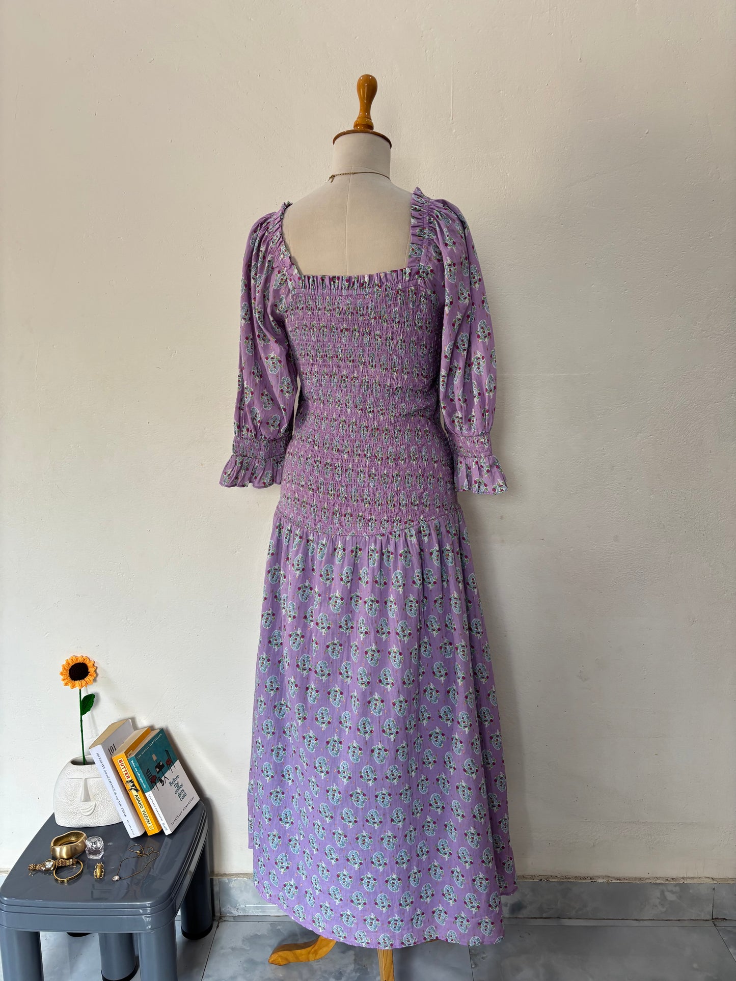 Purple smocked drop waist paisley print maxi dress.